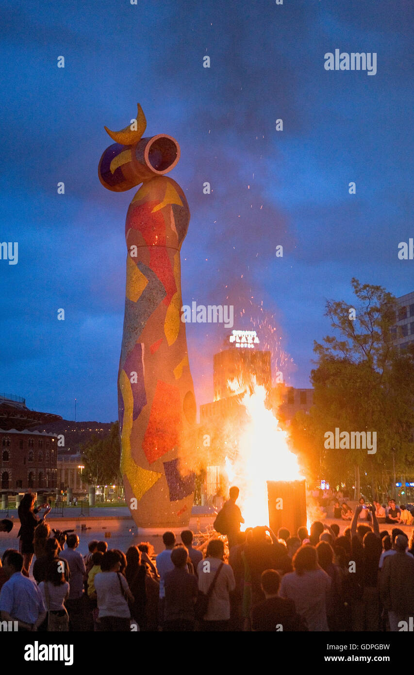`San Joan´ Bonfire. Verbena de San Juan. In Joan Miró Park.`Dona i ocell´sculpture. Barcelona. Catalonia. Spain. Stock Photo